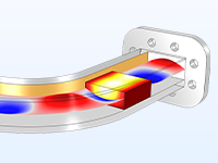 波导弯曲的模型，该模型部分透明，可揭示一个红白色和蓝色的表面图，该图代表了传播的波浪和一个介电块，温度为红色，黄色和白色颜色梯度。