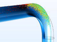 管道肘模型的特写视图，显示颗粒的速度。
